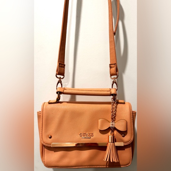 GUESS Peach Saffiano Crossbody Top Handle Bag w/ Bow Tassel & Long Strap - Picture 3 of 16